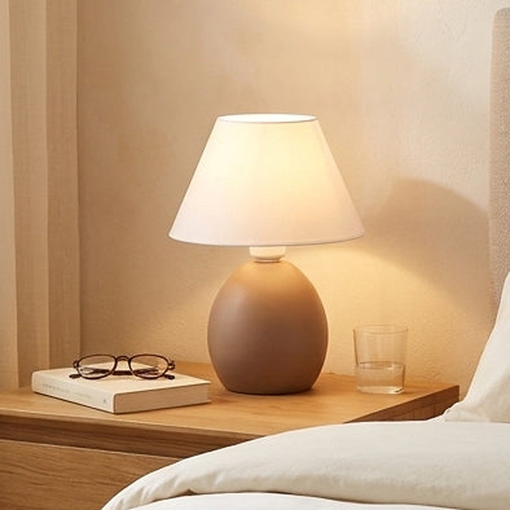 Abajur de cerâmica elipse marrom amêndoa com óculos e livro - Vittara Decor