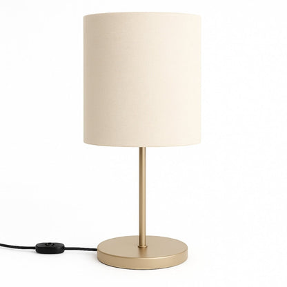 Abajur de mesa com base champanhe e cúpula cilíndrica de tecido bege - Vittara Decor