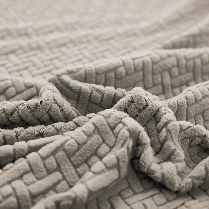 Detalhe da textura jacquard em relevo da Capa de Sofá Elástica - Vittara Decor