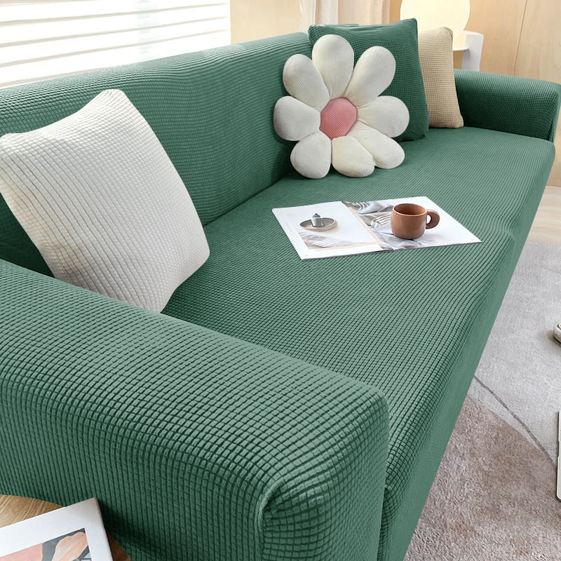 Detalhe do encaixe da capa de sofá ajustável na área do encosto - Vittara Decor
