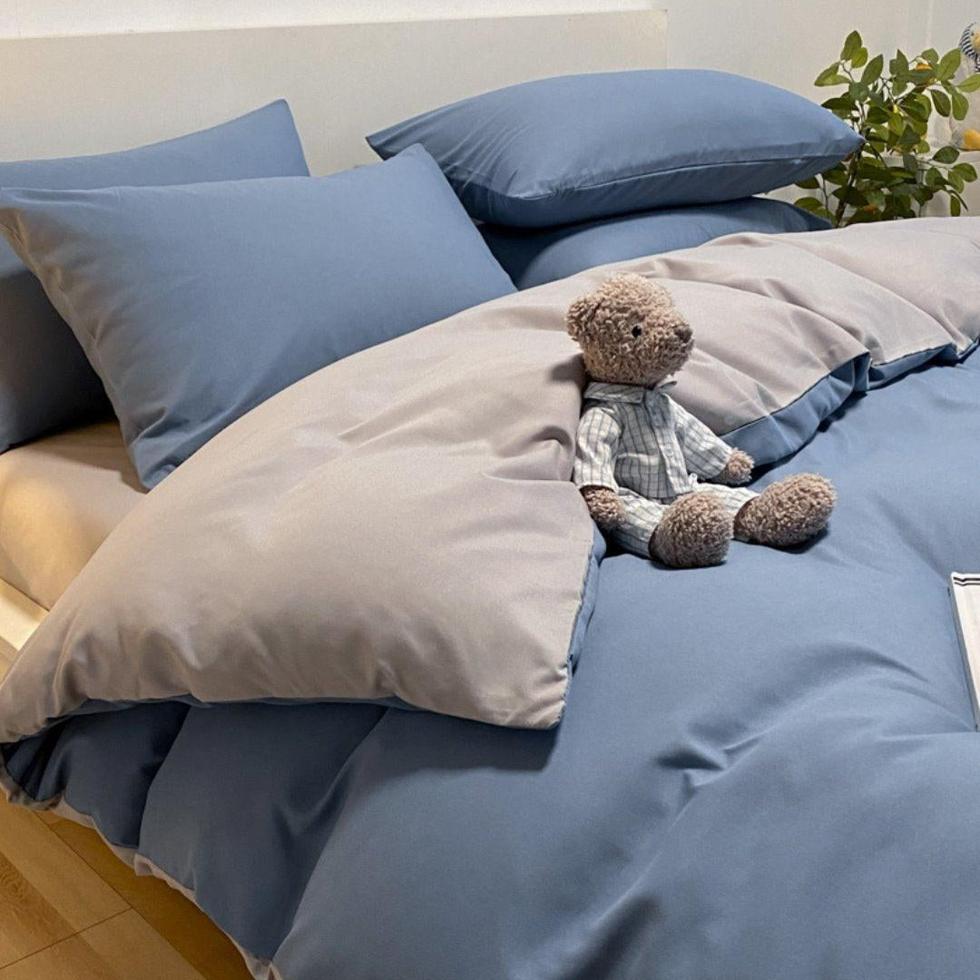 Jogo de cama nórdico azul com cinza reversível na cama - Vittara Decor