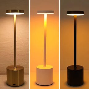 Luminária de mesa sem fio acesa nas cores ouro branco e preto - Vittara Decor