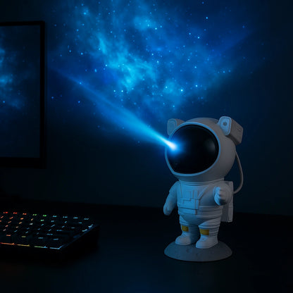 Projetor de galáxia astronauta em setup gamer com projeção de estrelas nas paredes ao fundo - Vittara Decor